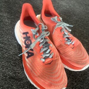 Hoka Coral Orange Running Shoes with Light Gray Laces